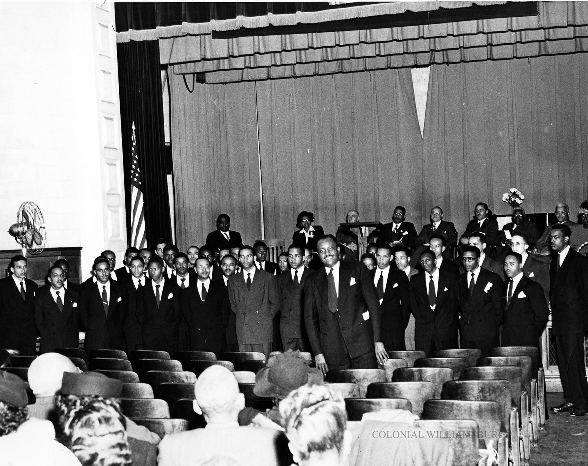 Group Of African American Men Standing At The Front Of The Bruton Heights Auditorium 